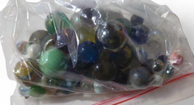 A quantity of glass marbles, various sizes, some h