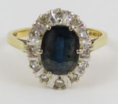An 18ct gold sapphire and diamond cluster ring, ea