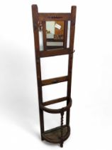 A 20th century stained oak hall stand, with mirror