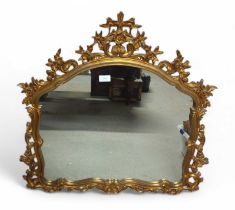 A highly decorative gilt wood framed mirror, with