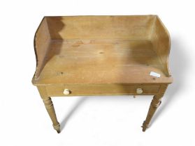 A Victorian pine washstand with low raised back an