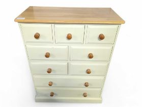 A modern light oak and cream lacquer chest of draw