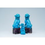 Three Chinese turquoise and aubergine glazed models of Buddhist lions, 20th C.