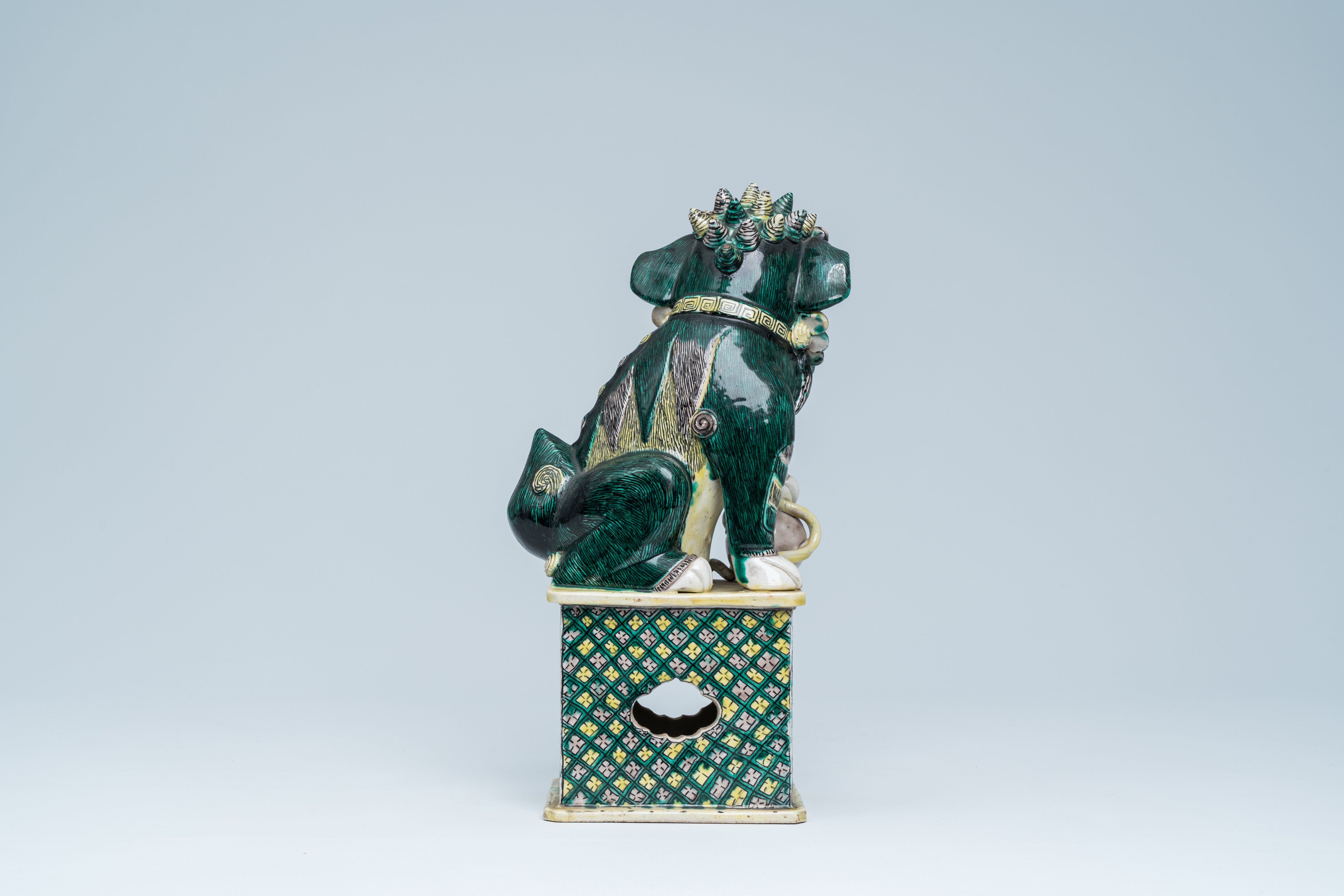 A Chinese verte biscuit model of a Buddhist lion, 19th C. - Image 4 of 15