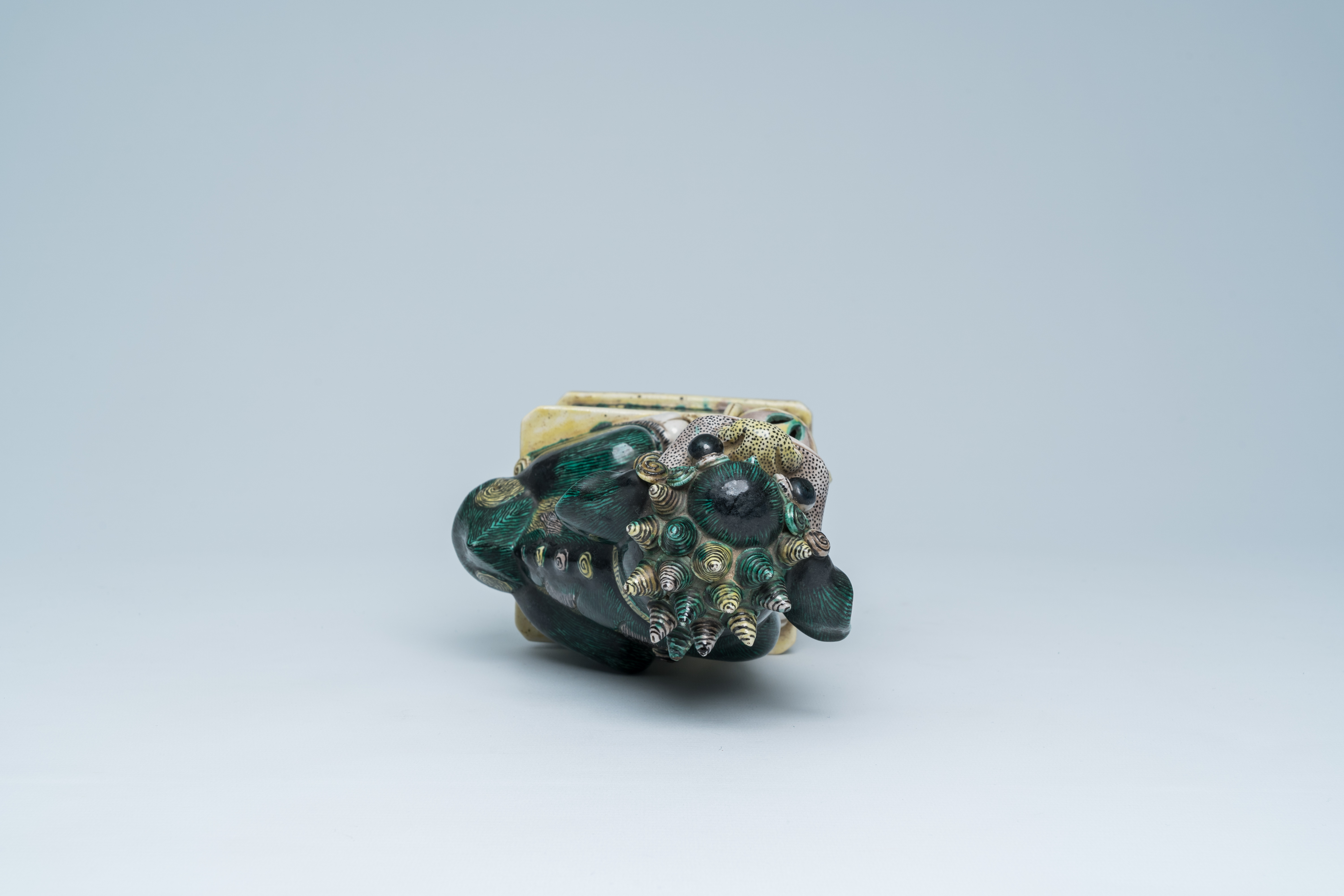 A Chinese verte biscuit model of a Buddhist lion, 19th C. - Image 6 of 15