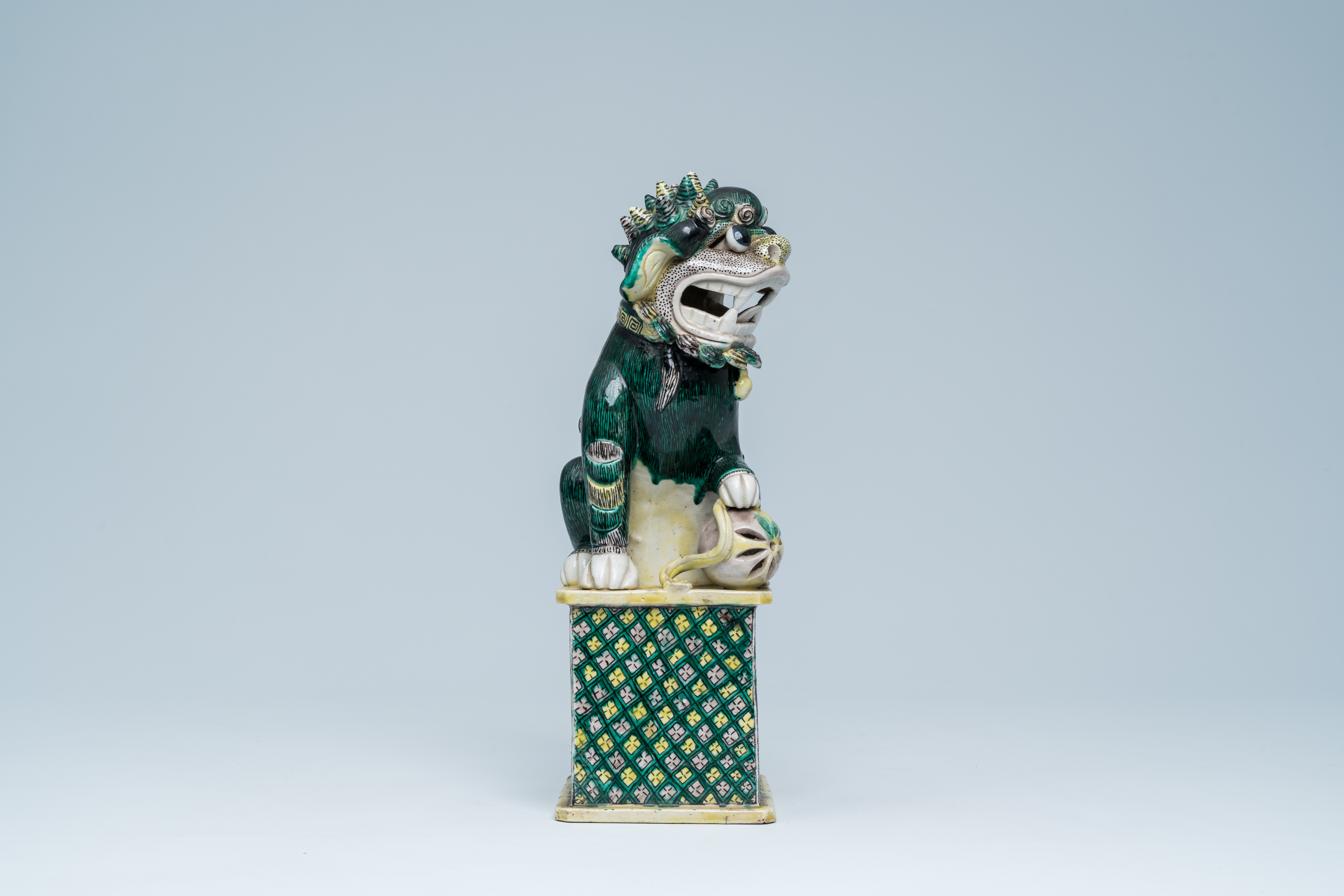 A Chinese verte biscuit model of a Buddhist lion, 19th C. - Image 5 of 15