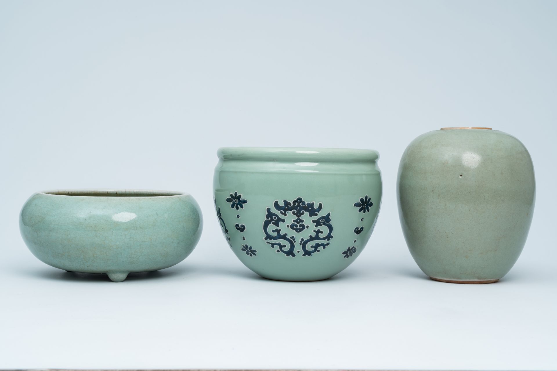 A Chinese celadon incense burner, a ginger jar and a jardiniere, 19th/20th C. - Image 2 of 7