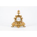 An impressive French gilt bronze mantel clock with floral design and a cartouche, late 19th C.