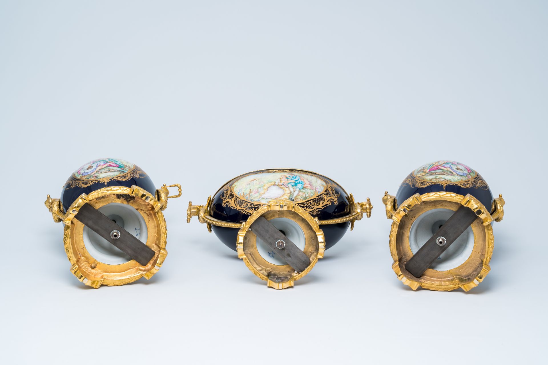 A French gilt mounted blue ground gold layered three-piece garniture with lovely scenes by Lebret, S - Image 6 of 6