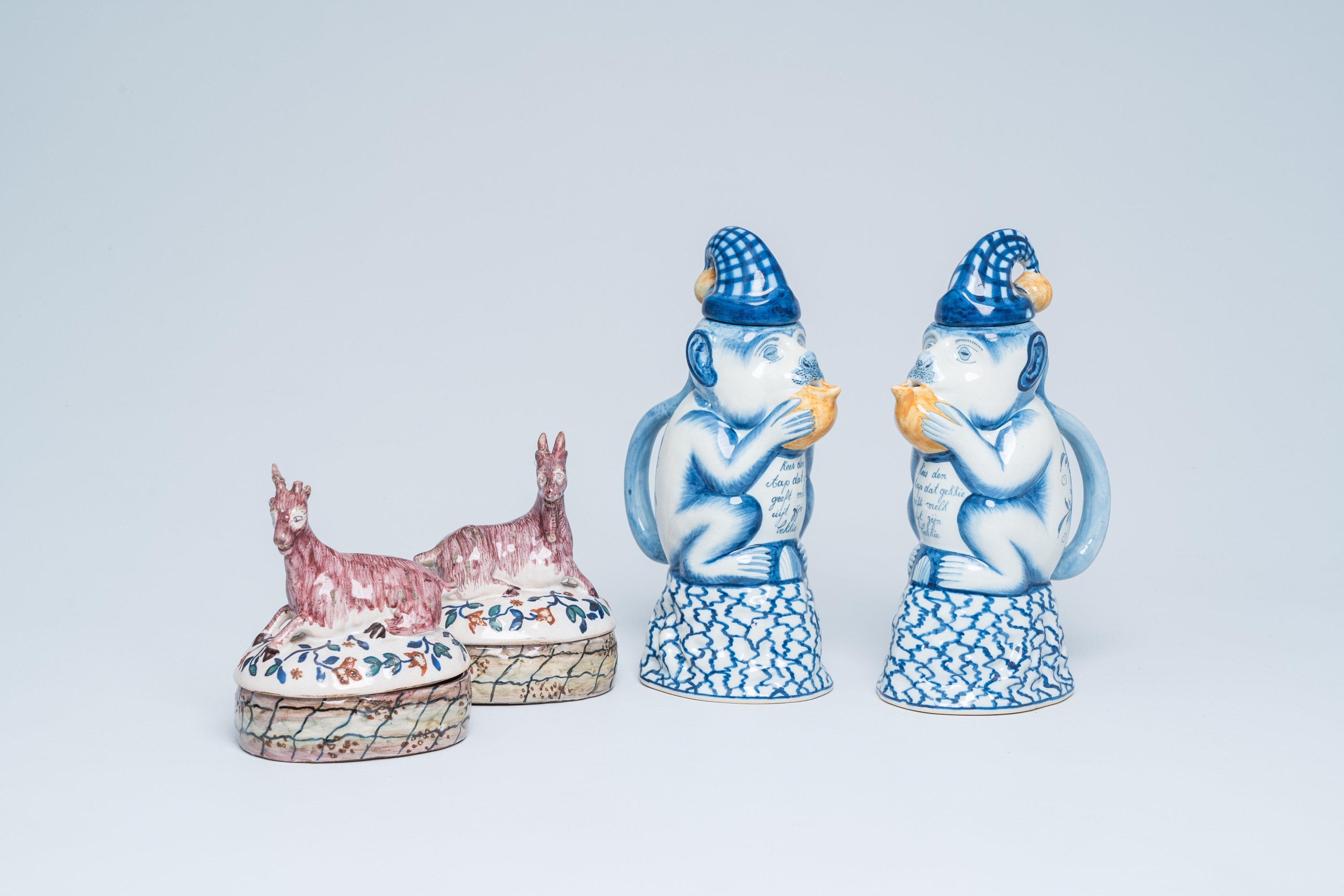 Two polychrome Dutch monkey ewers and two butter tubs with goat-shaped covers, Delft and Makkum, 19t