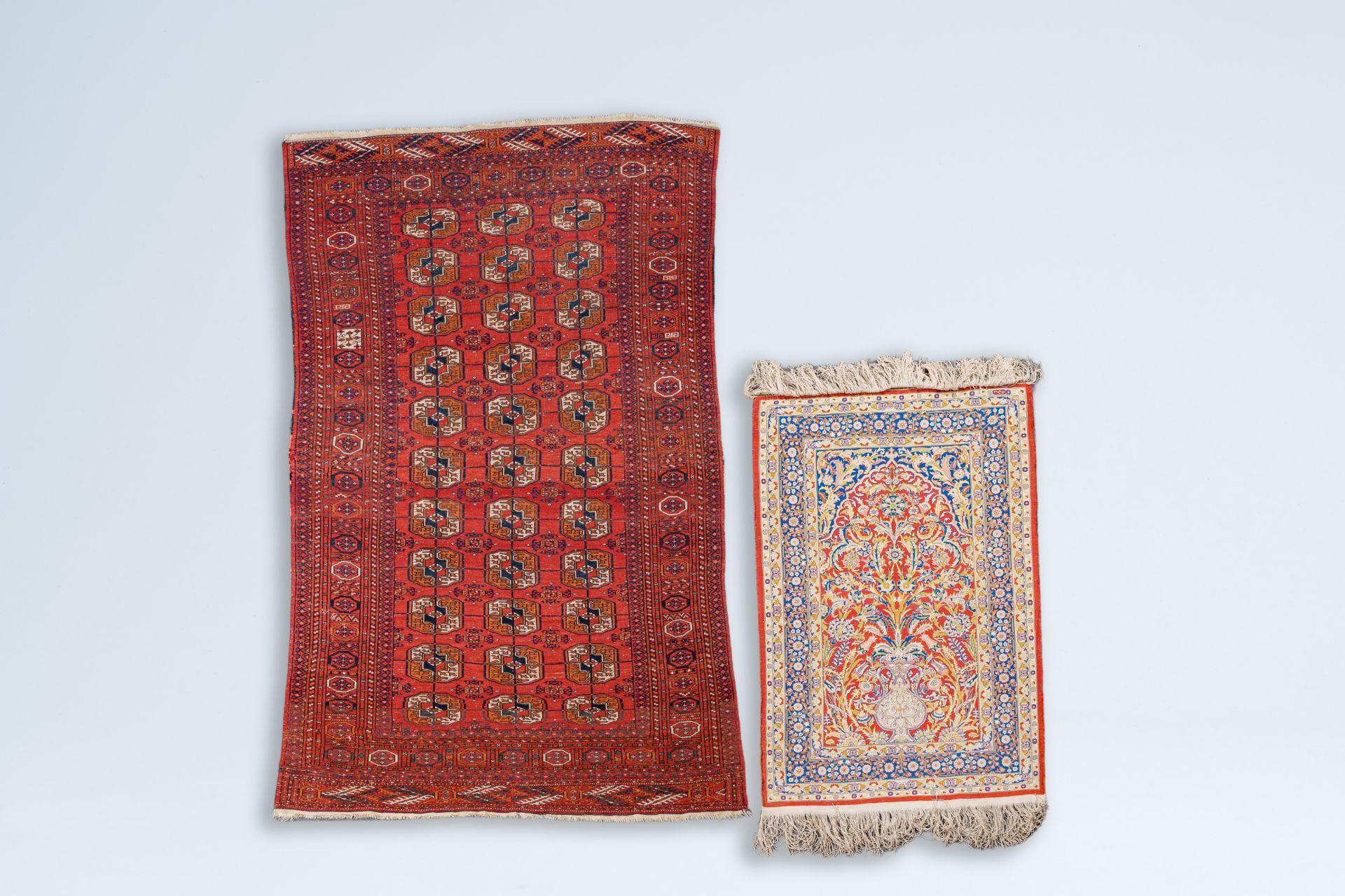 A Turkmen Tekke rug, wool on cotton, and an oriental rug with floral design, silk on cotton, 20th C. - Image 2 of 4