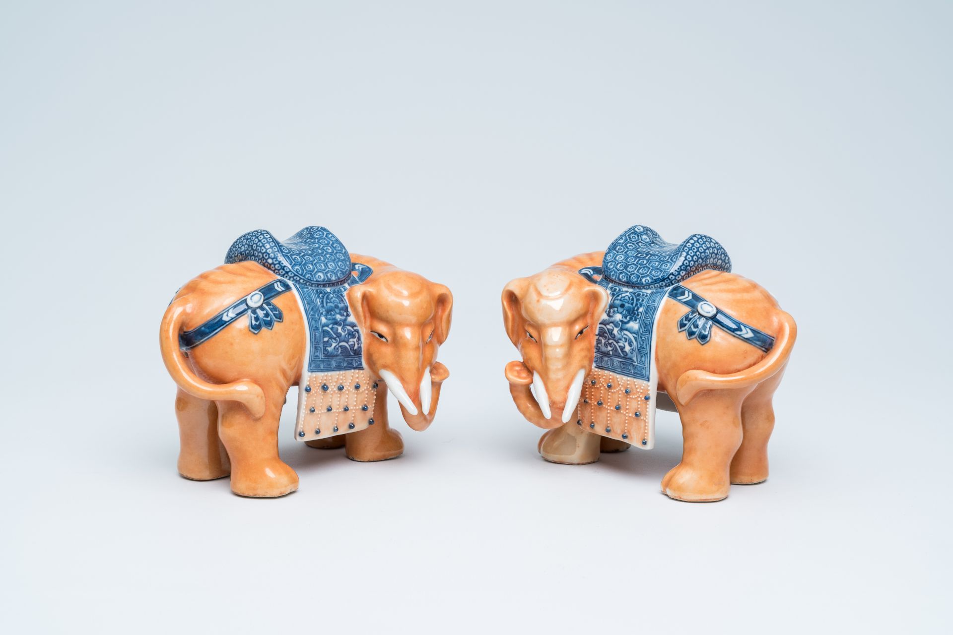 A pair of Chinese polychrome models of elephants, 20th C.