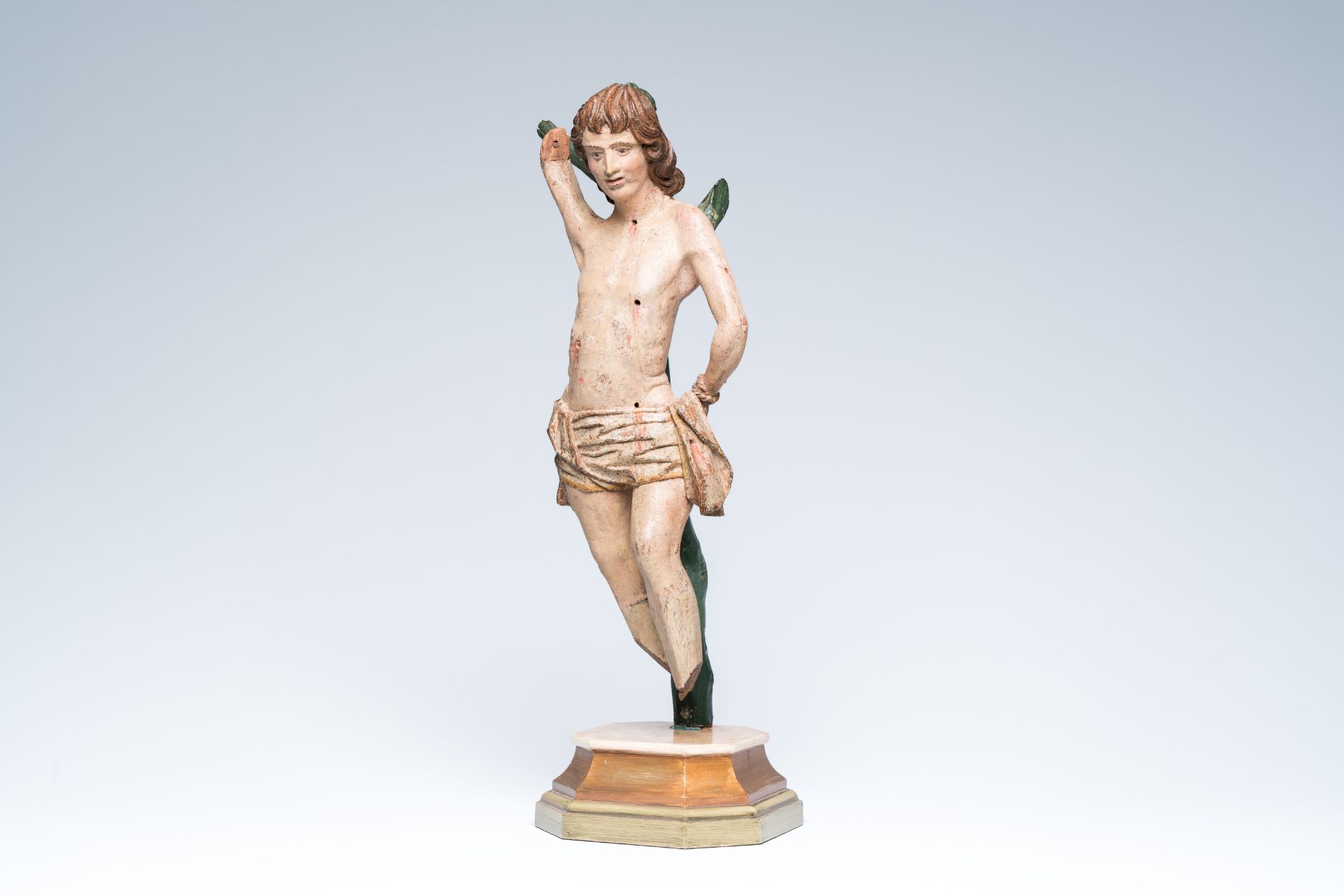 A South German carved and polychrome painted wood Saint Sebastian, 16th C.