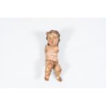 A Flemish carved and polychrome painted wood putto, 17th/18th C.