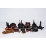 A varied collection of Chinese wood stands and plate holders, 19th/20th C.