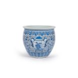 A large Chinese blue and white jardiniere with boys carrying a vase and cover and birds among blosso