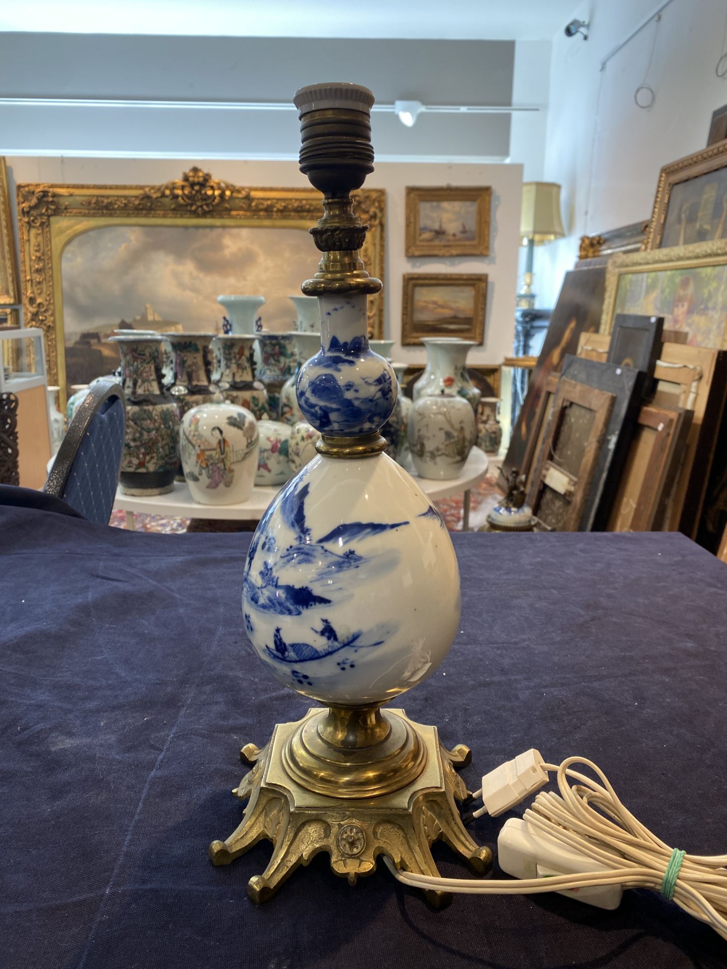 A Chinese blue and white bottle shaped vase with an animated river landscape mounted as a lamp, 19th - Image 9 of 13