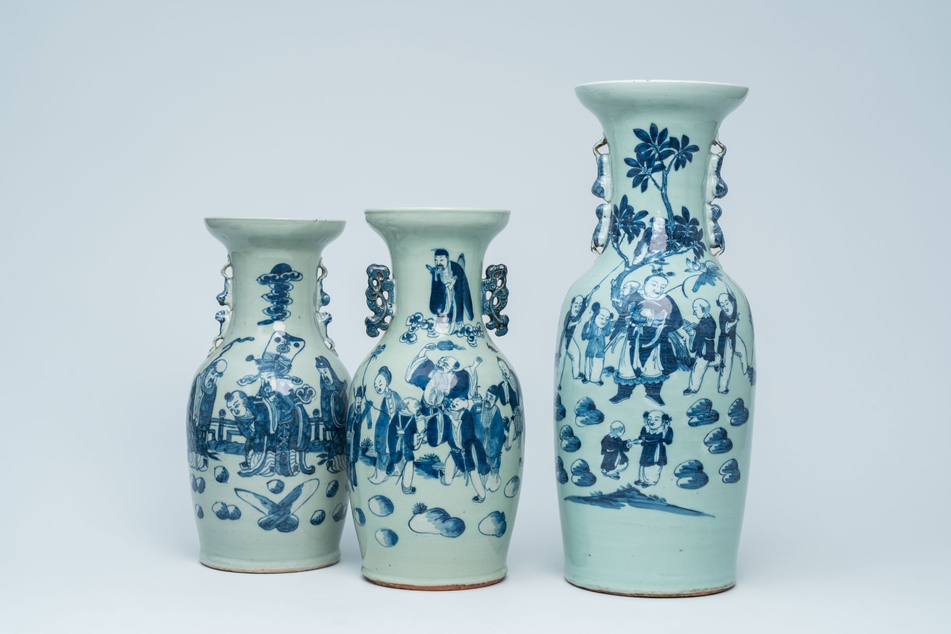 Three Chinese blue and white celadon ground vases with Immortals and their servants in a landscape,