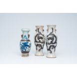 A pair of Chinese Nanking crackle glazed relief decorated 'dragon' vases and a blue and white 'Buddh