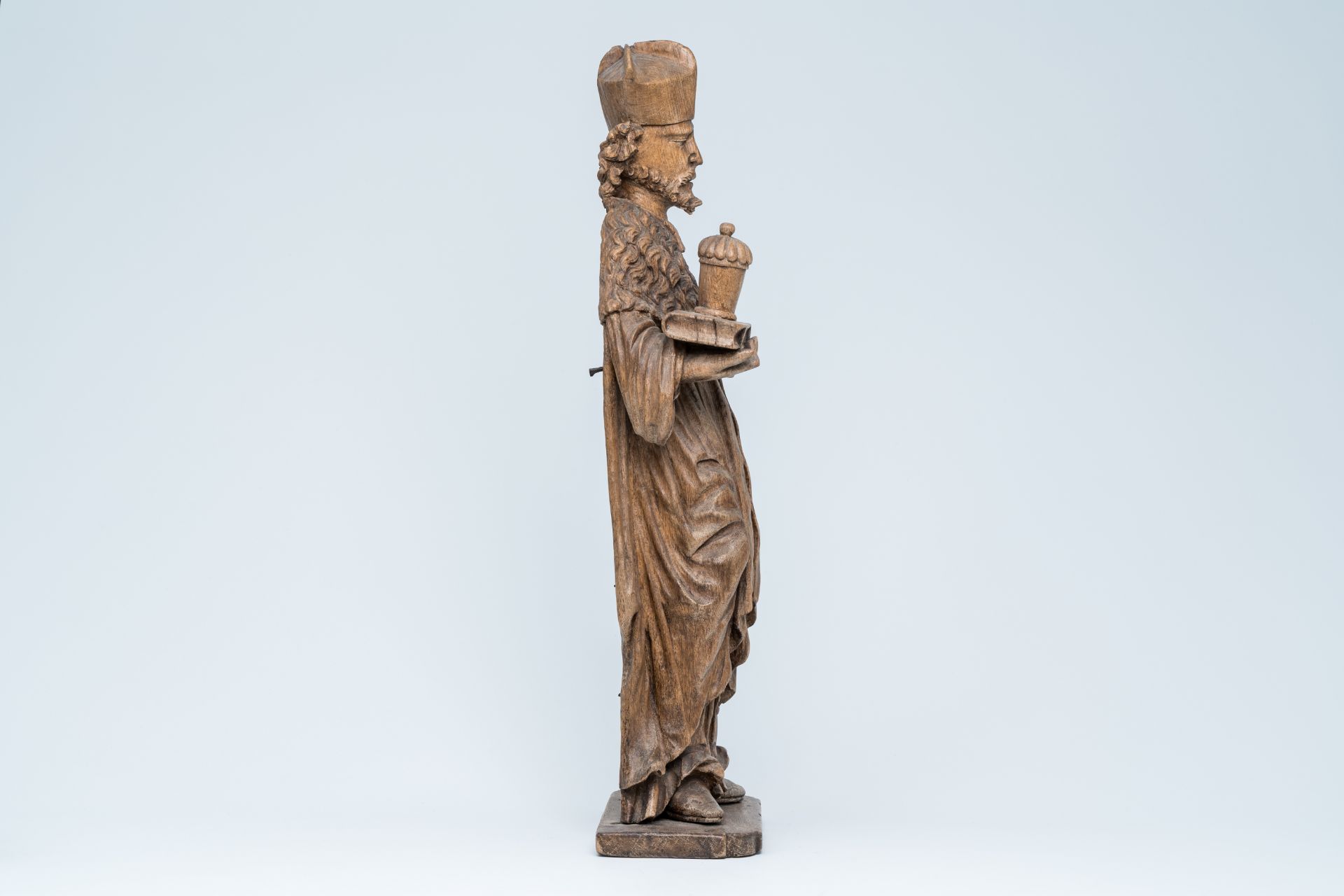 A large wood sculpture of Saint Damian holding a book and an ointment jar, Central Europe, 17th C. - Image 5 of 7