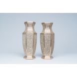 A pair of hexagonal Vietnamese openworked silver plated vases with floral design, 20th C.