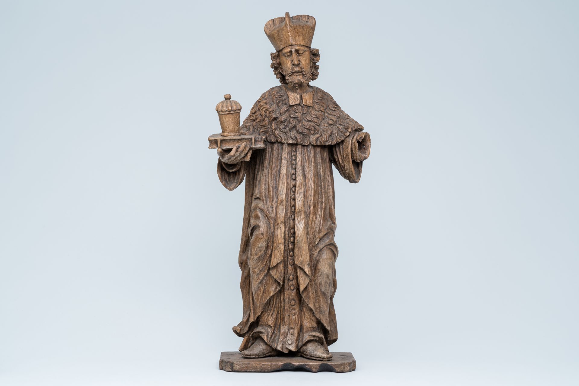 A large wood sculpture of Saint Damian holding a book and an ointment jar, Central Europe, 17th C. - Image 2 of 7