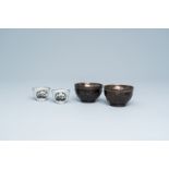 Two Chinese enamel cups and two coconut cups with silvered insets, 19th C.
