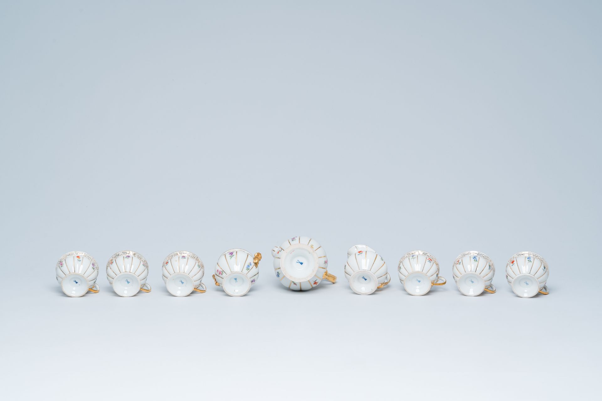 A German fifteen-piece polychrome and gilt Meissen mocha service with floral design, 20th C. - Image 10 of 10