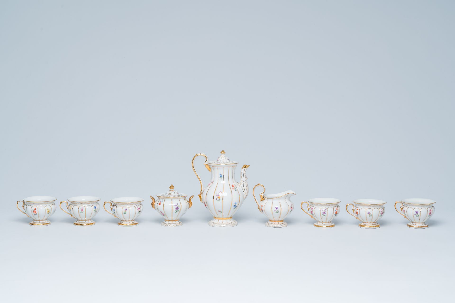 A German fifteen-piece polychrome and gilt Meissen mocha service with floral design, 20th C. - Image 7 of 10
