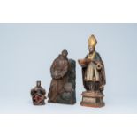 Three polychromed wood sculptures of a bishop, God the Father and Saint-Franciscus, 18th/19th C.