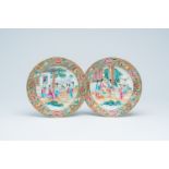 A pair of Chinese Canton famille rose plates with palace scenes, 19th C.