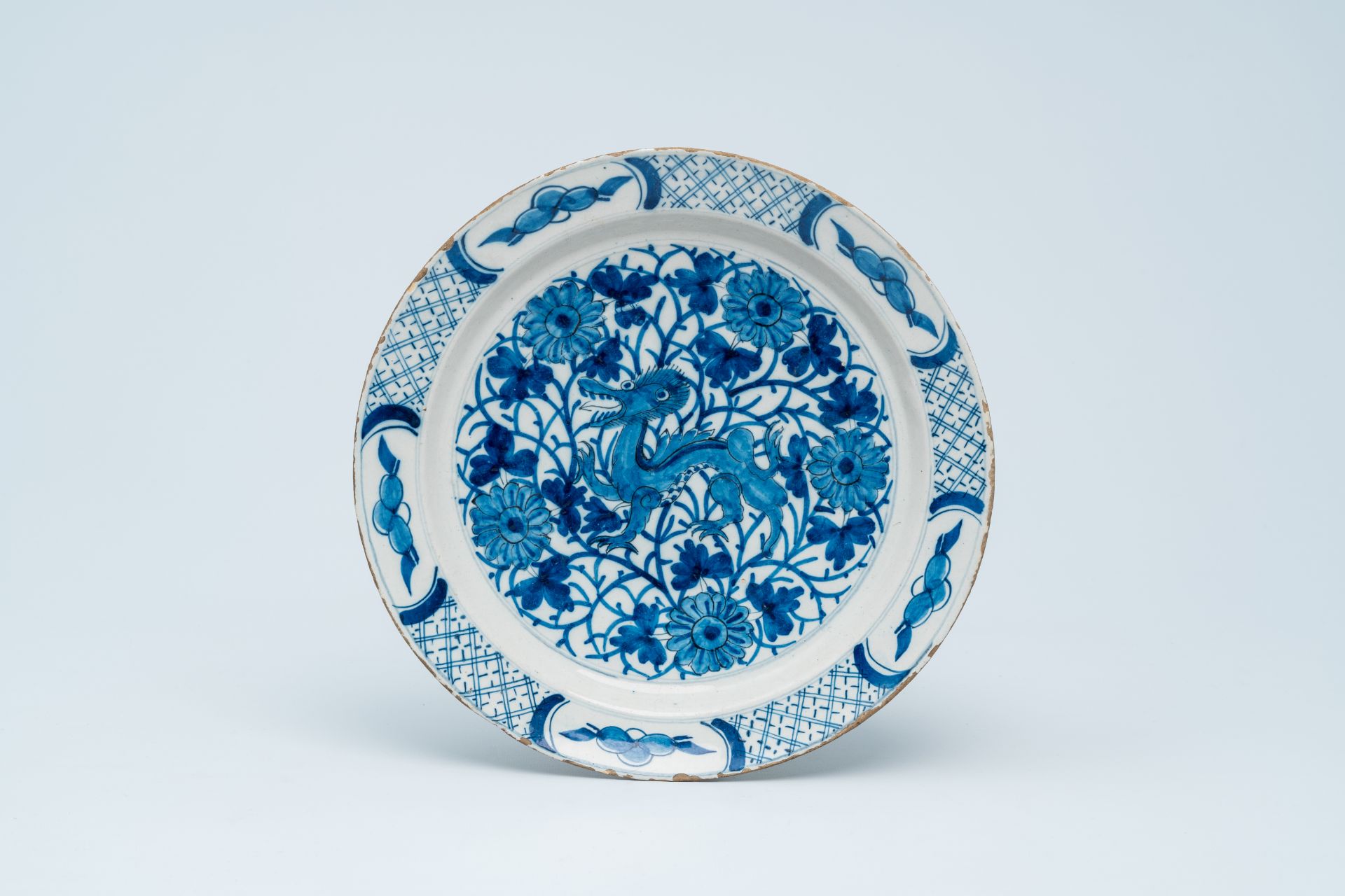 Seven various Dutch Delft blue and white chargers with landscapes, a dragon and floral design, 18th - Bild 8 aus 9