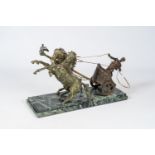 A group of a Roman two-horse charioteer in patinated zamac on a vert de mer marble base, 20th C.