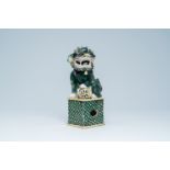 A Chinese verte biscuit model of a Buddhist lion, 19th C.