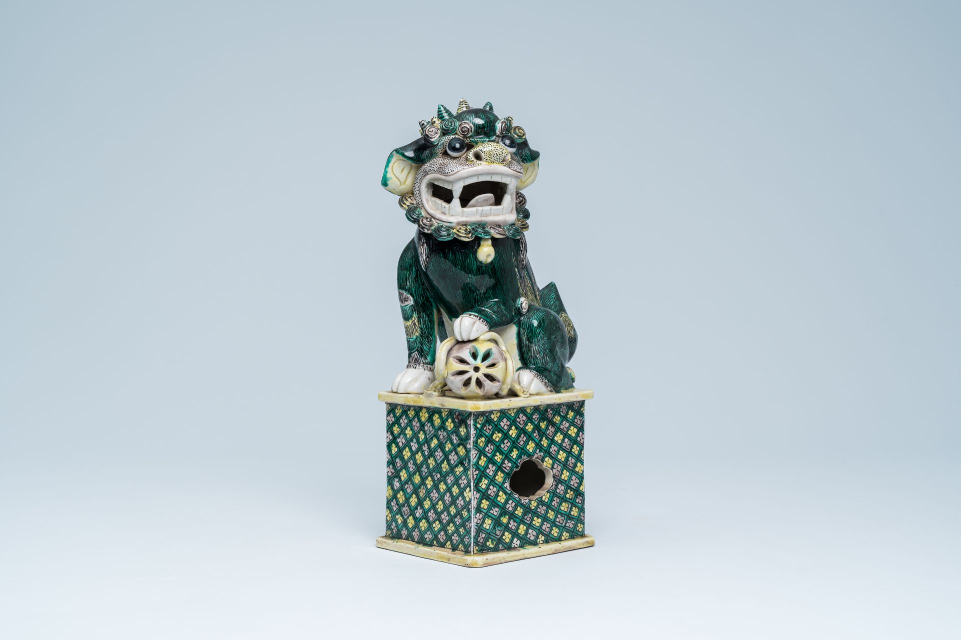 A Chinese verte biscuit model of a Buddhist lion, 19th C.