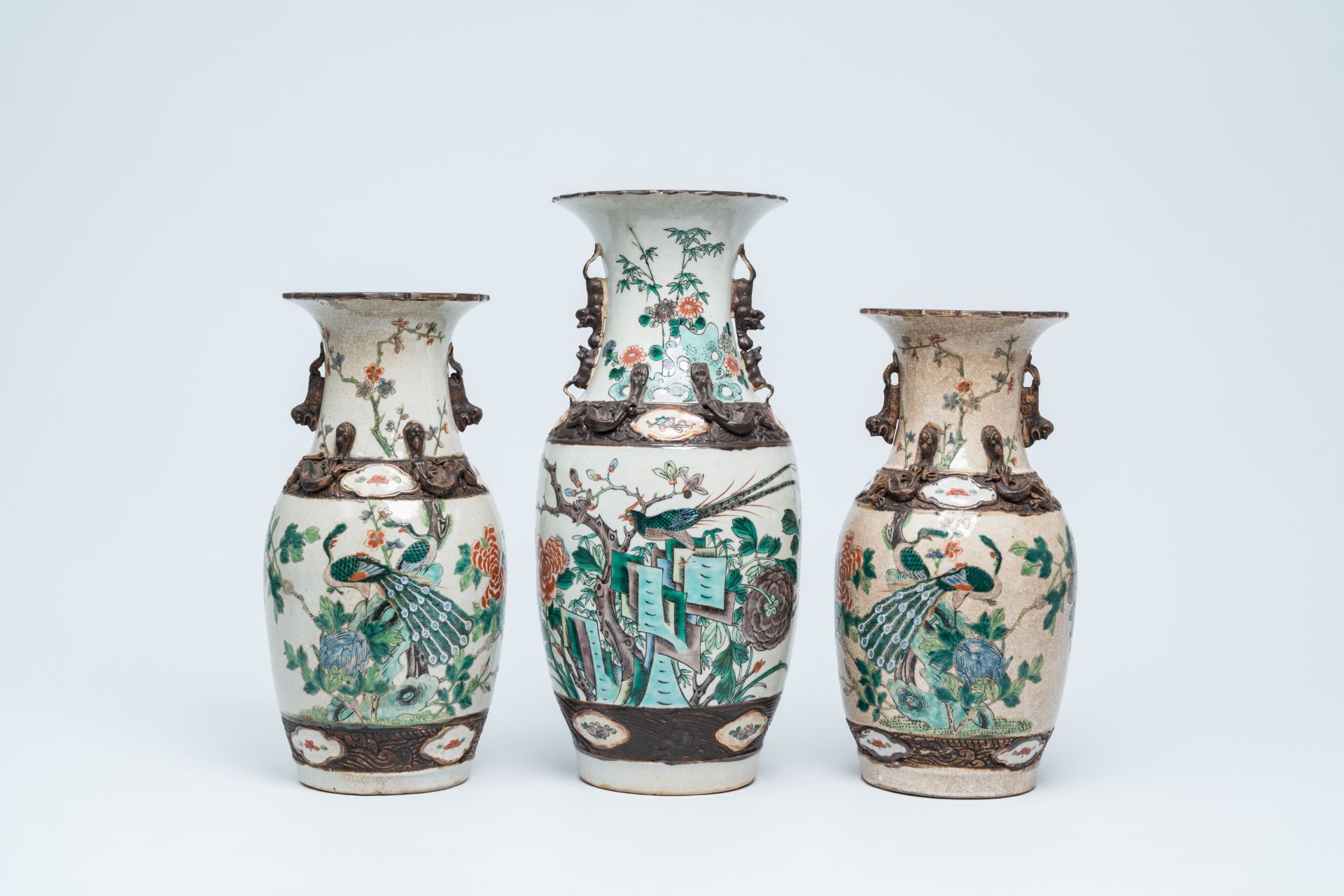 Three Chinese Nanking crackle glazed famille verte vases with birds among blossoming branches, 19th