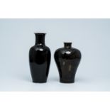 Two Chinese monochrome black-glazed vases, one with gilt dragon design, Kangxi and Qianlong marks, 1