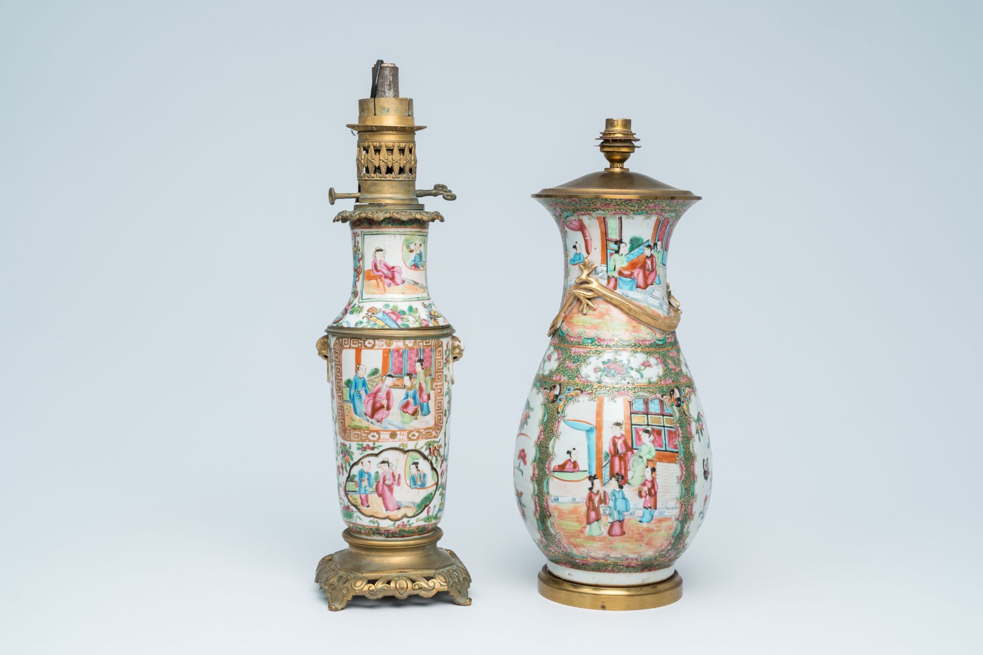 Two Chinese Canton famille rose vases with palace scenes and floral design mounted as lamps, 19th C.
