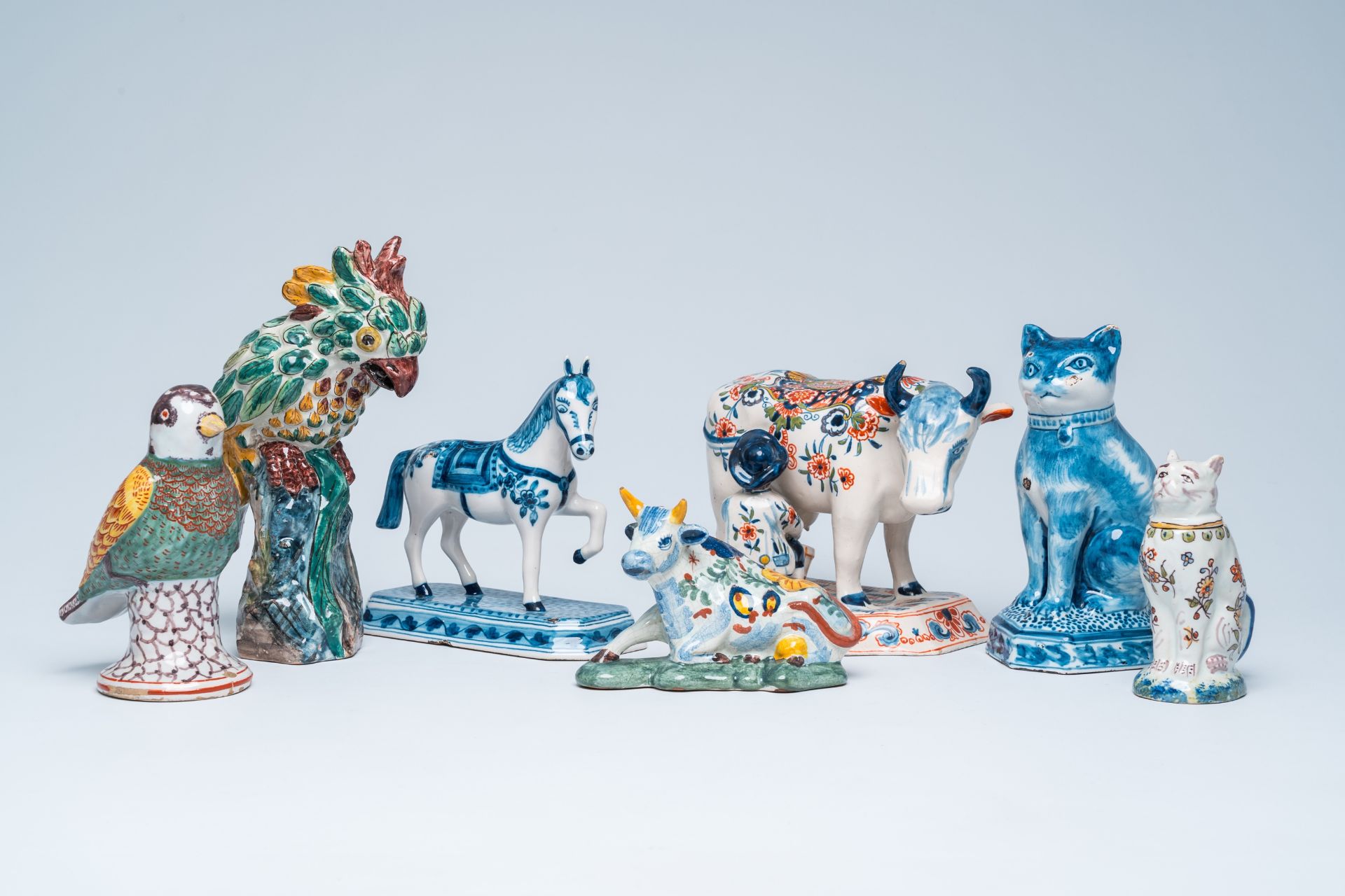 Seven blue, white and polychrome Delft-style animal sculptures, incl. Desvres and Makkum, 19th/20th