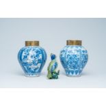 A pair of blue and white Dutch Delft vases with brass mounts and a polychrome Brussels faience model