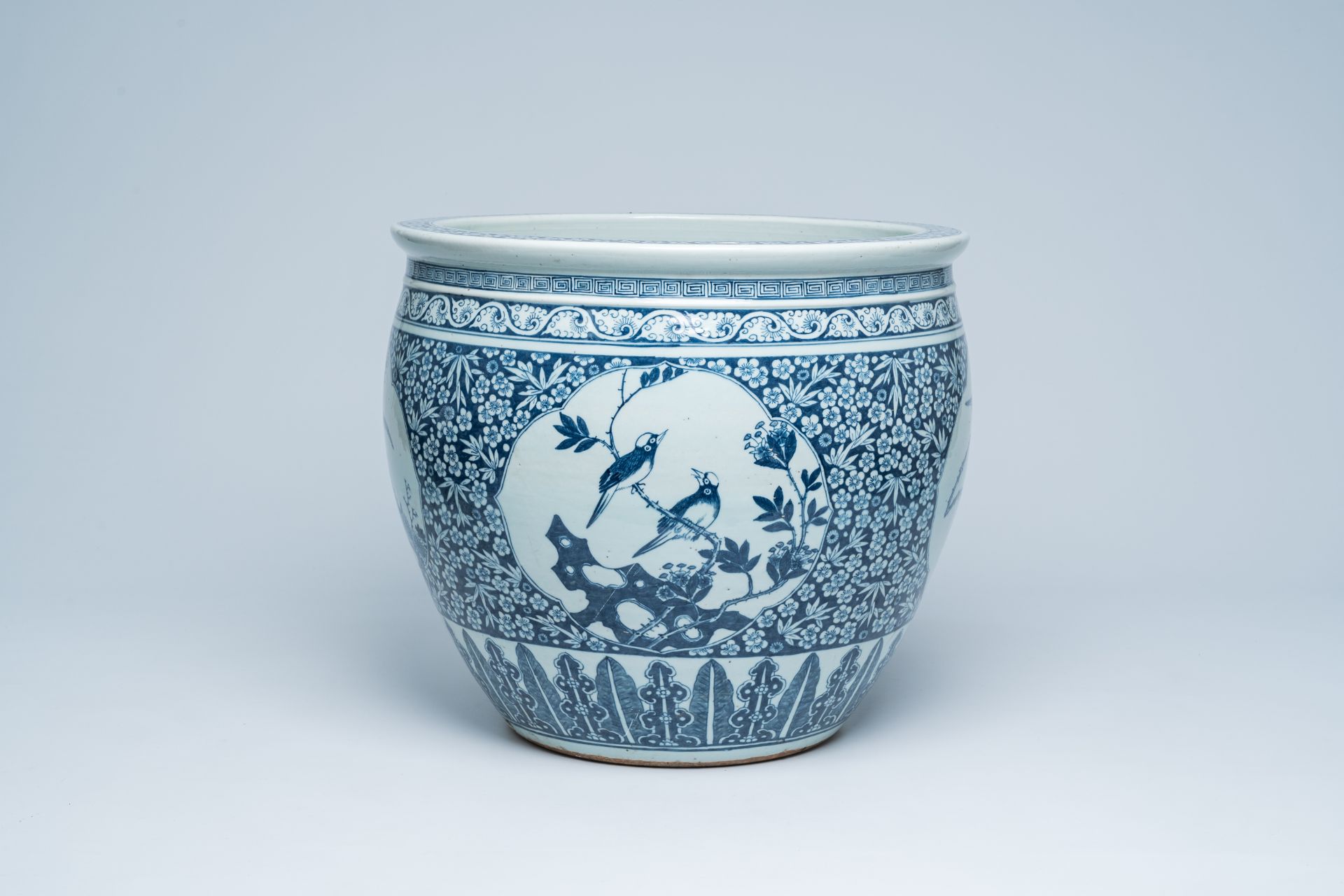 A Chinese blue and white fish bowl with bird medallions, 19th C.