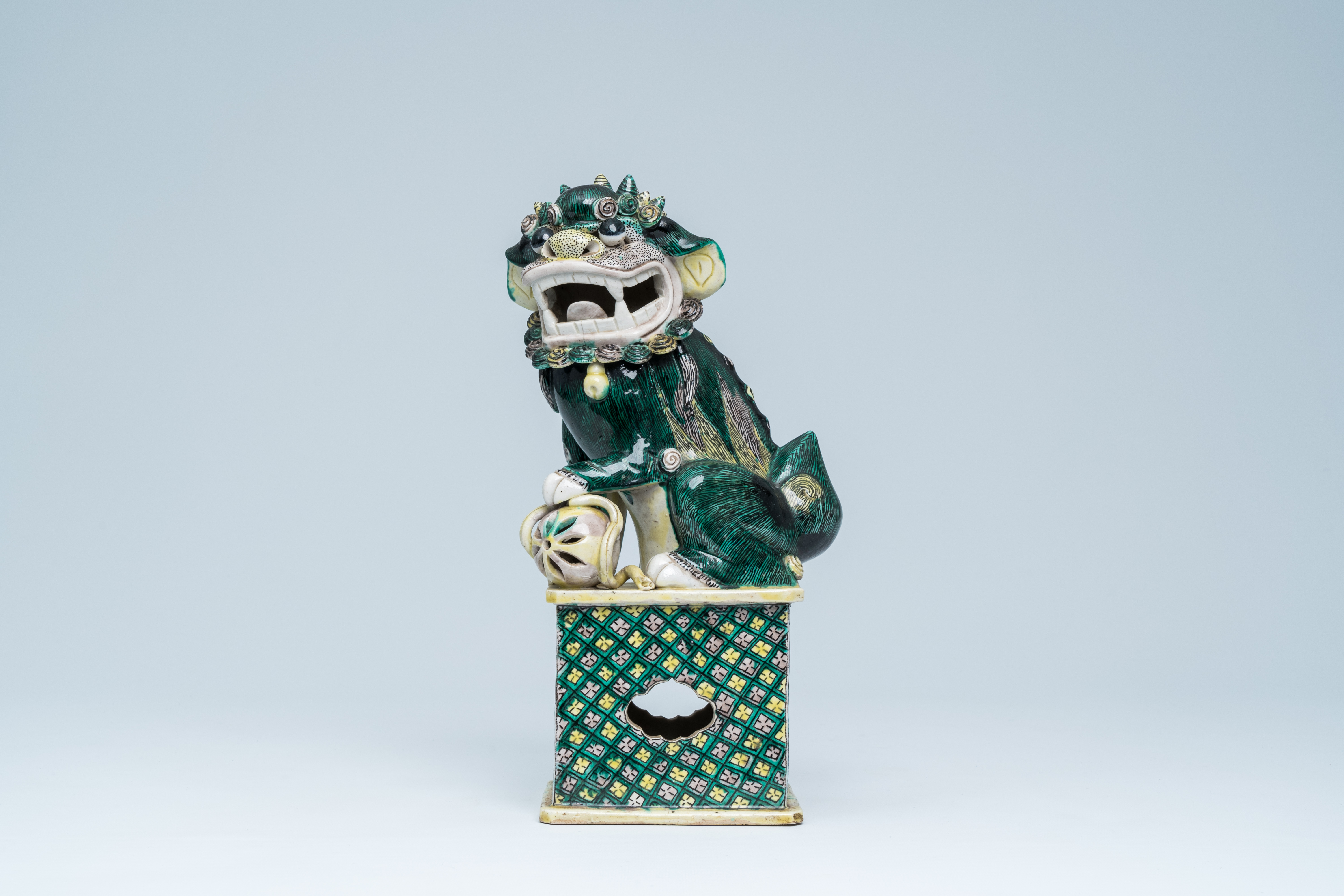 A Chinese verte biscuit model of a Buddhist lion, 19th C. - Image 2 of 15