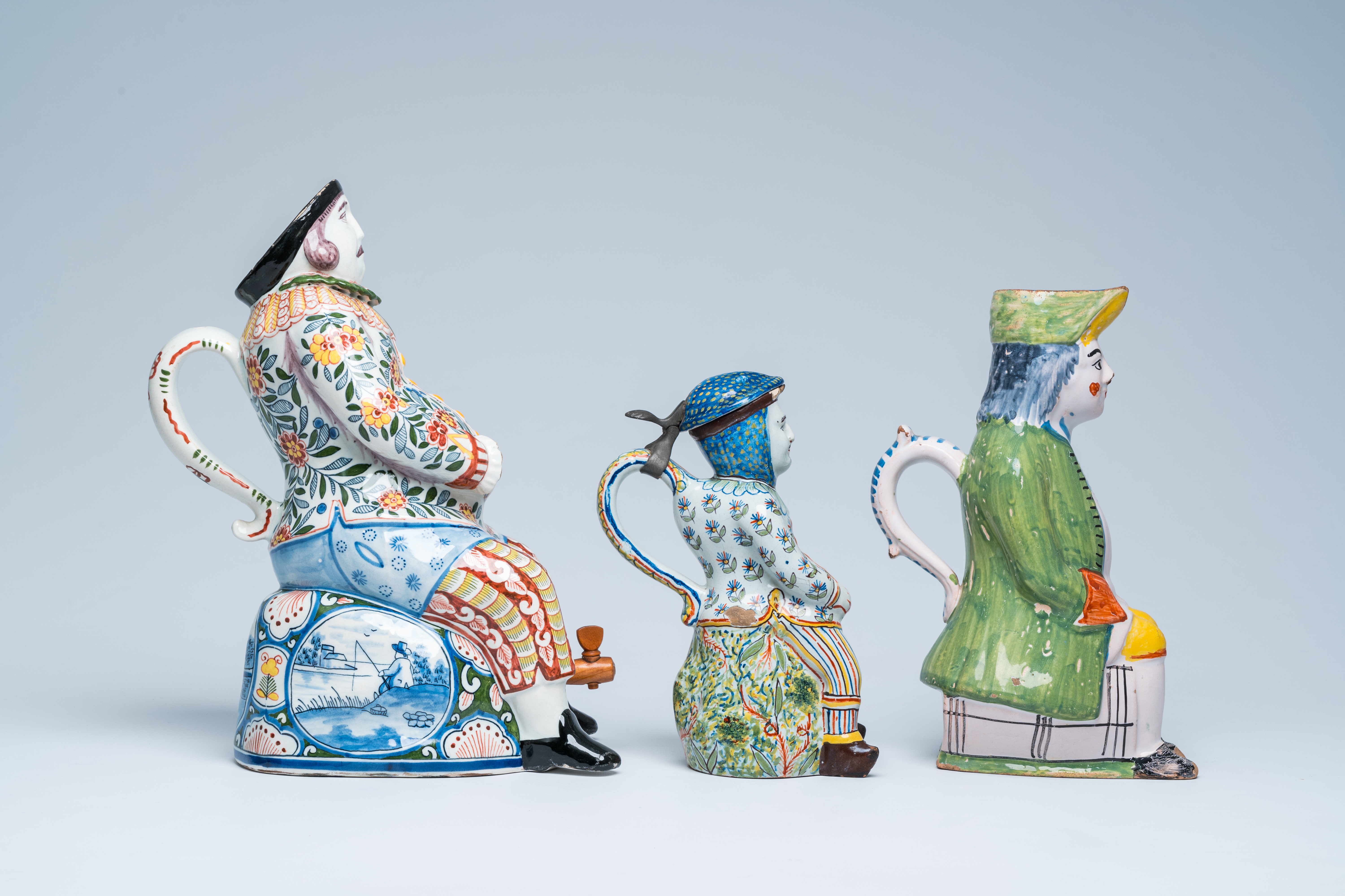 Three polychrome Delft and French faience 'bobbejak' jugs in the shape of men, 19th C. - Image 4 of 8