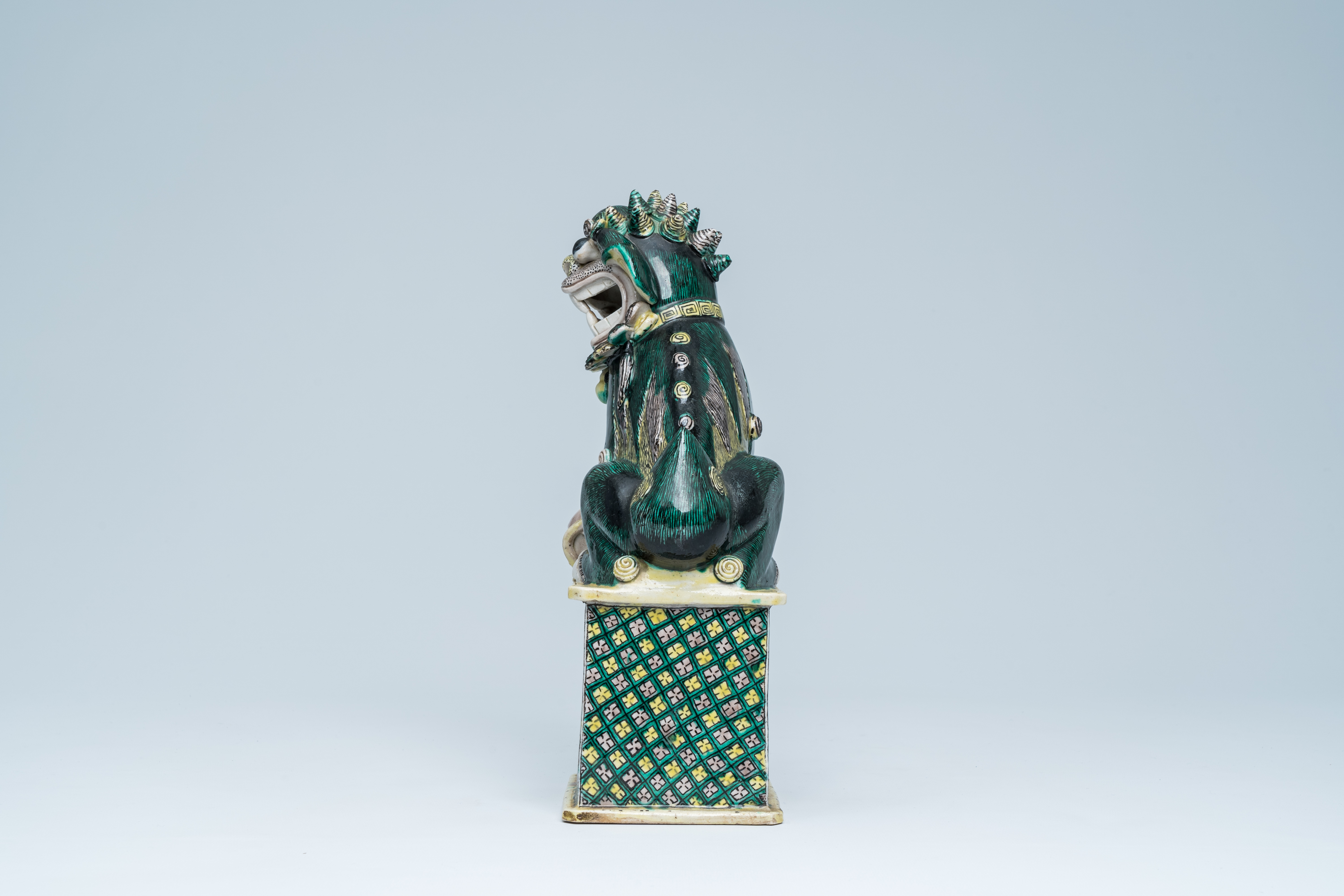 A Chinese verte biscuit model of a Buddhist lion, 19th C. - Image 3 of 15