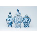 Three Dutch Delft blue and white vases and covers with birds among blossoming branches and chinoiser