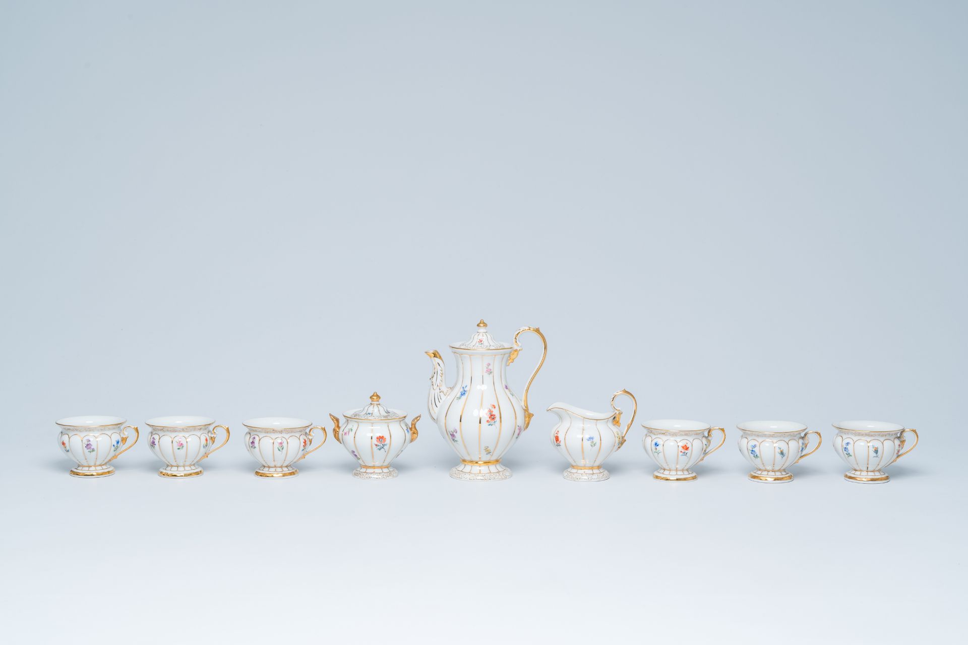 A German fifteen-piece polychrome and gilt Meissen mocha service with floral design, 20th C. - Image 5 of 10