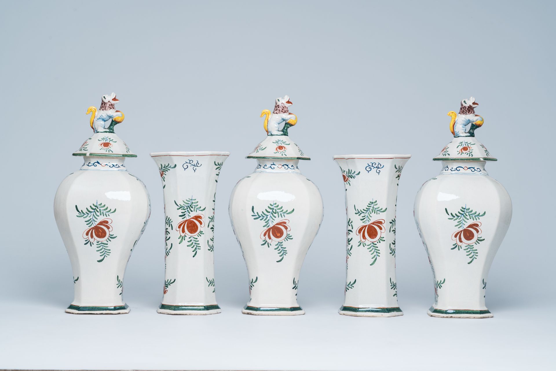 A Dutch Delft polychrome five-piece vase garniture with animated scenes, 19th C. - Image 3 of 7