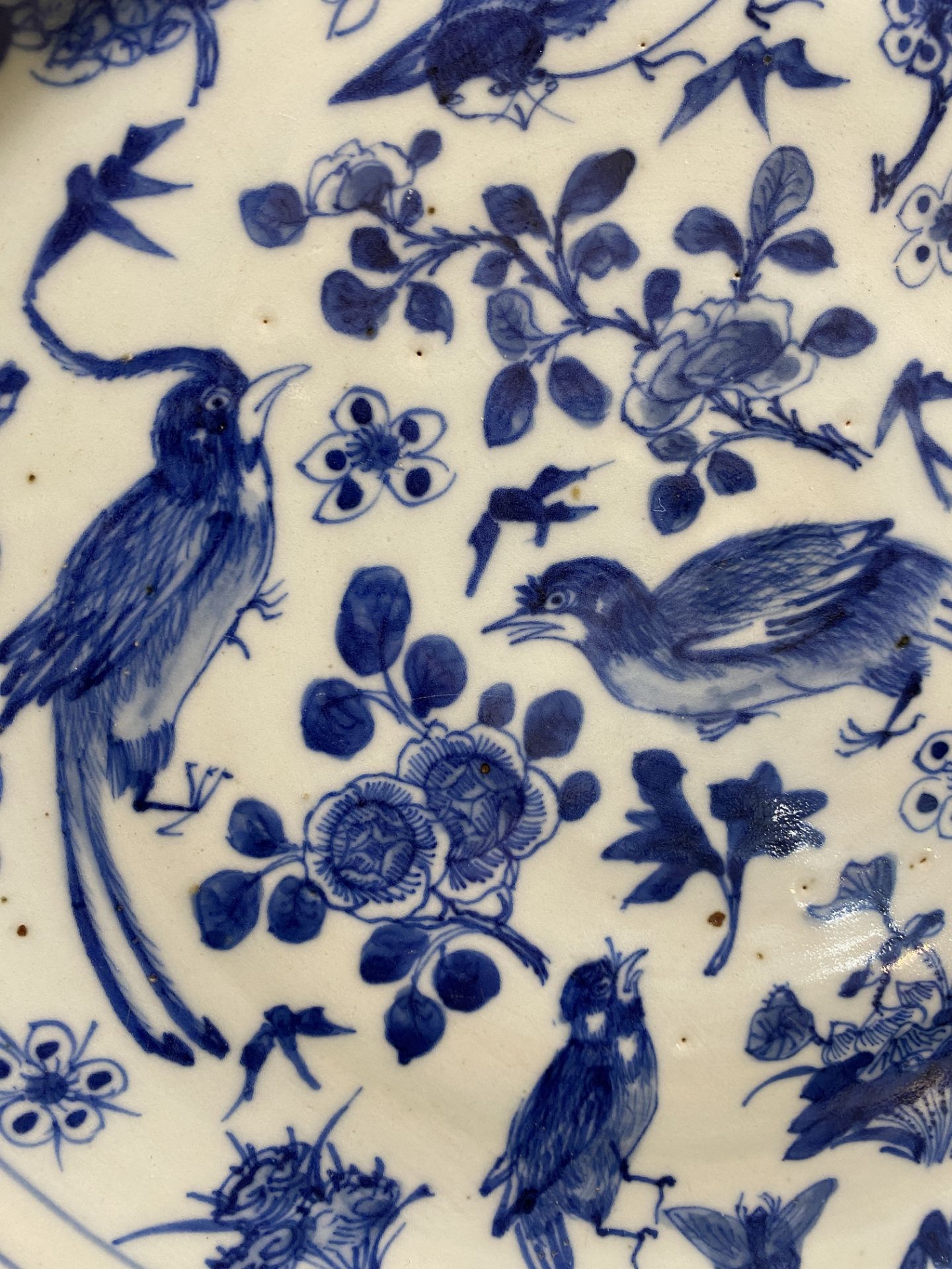 Four Chinese blue and white chargers with figures and birds among blossoming branches, 19th C. - Image 17 of 17