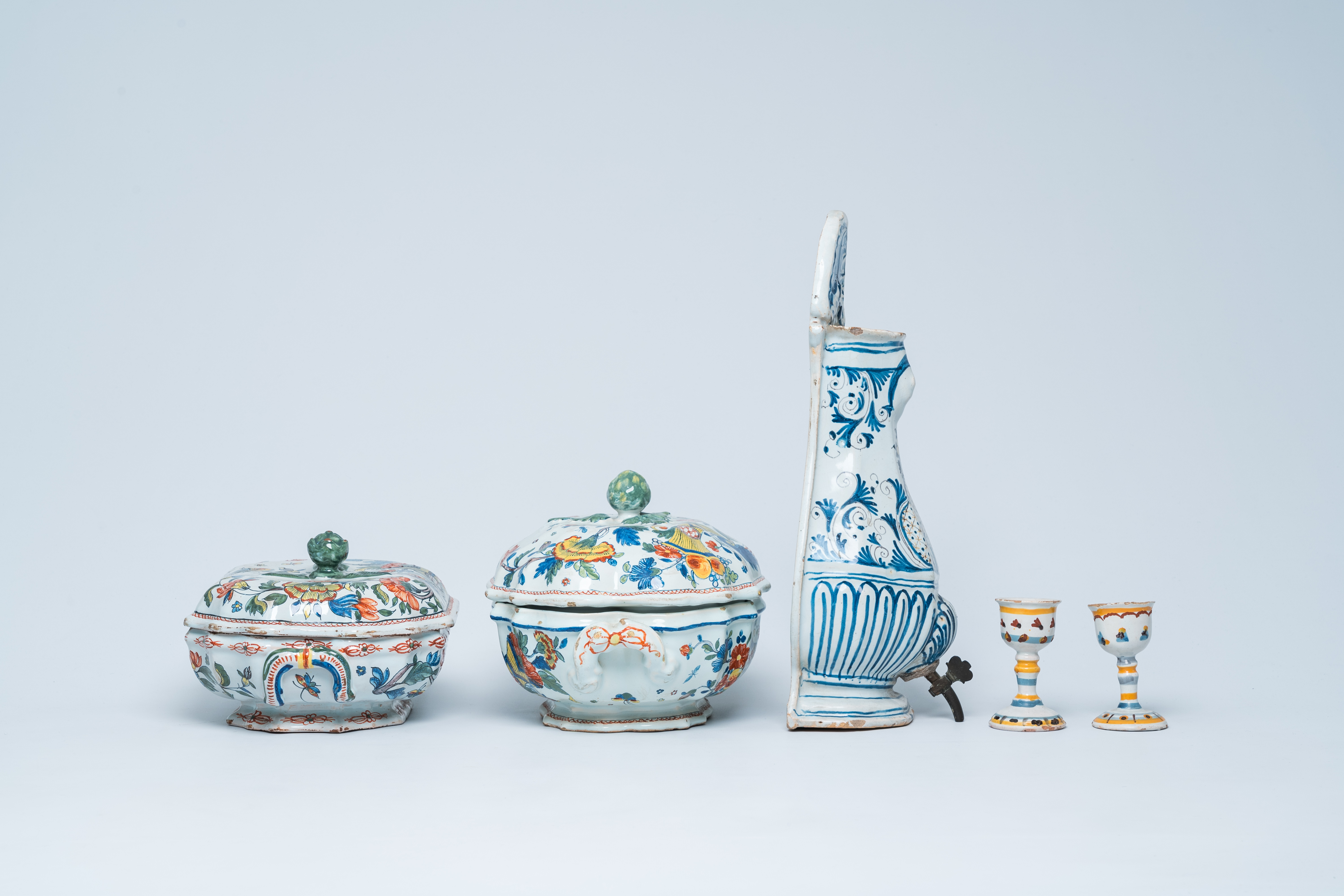 Two polychrome French Rouen faience tureens and covers, a pair of egg cups and a wall fountain, 18th - Image 4 of 9