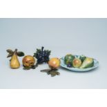 An extensive collection of polychrome Dutch Delft fruits and a plate decorated with fruit, 18th/19th